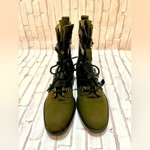 Jerome C. Rousseau
Canvas Distressed Accents Combat Boots. Size 9